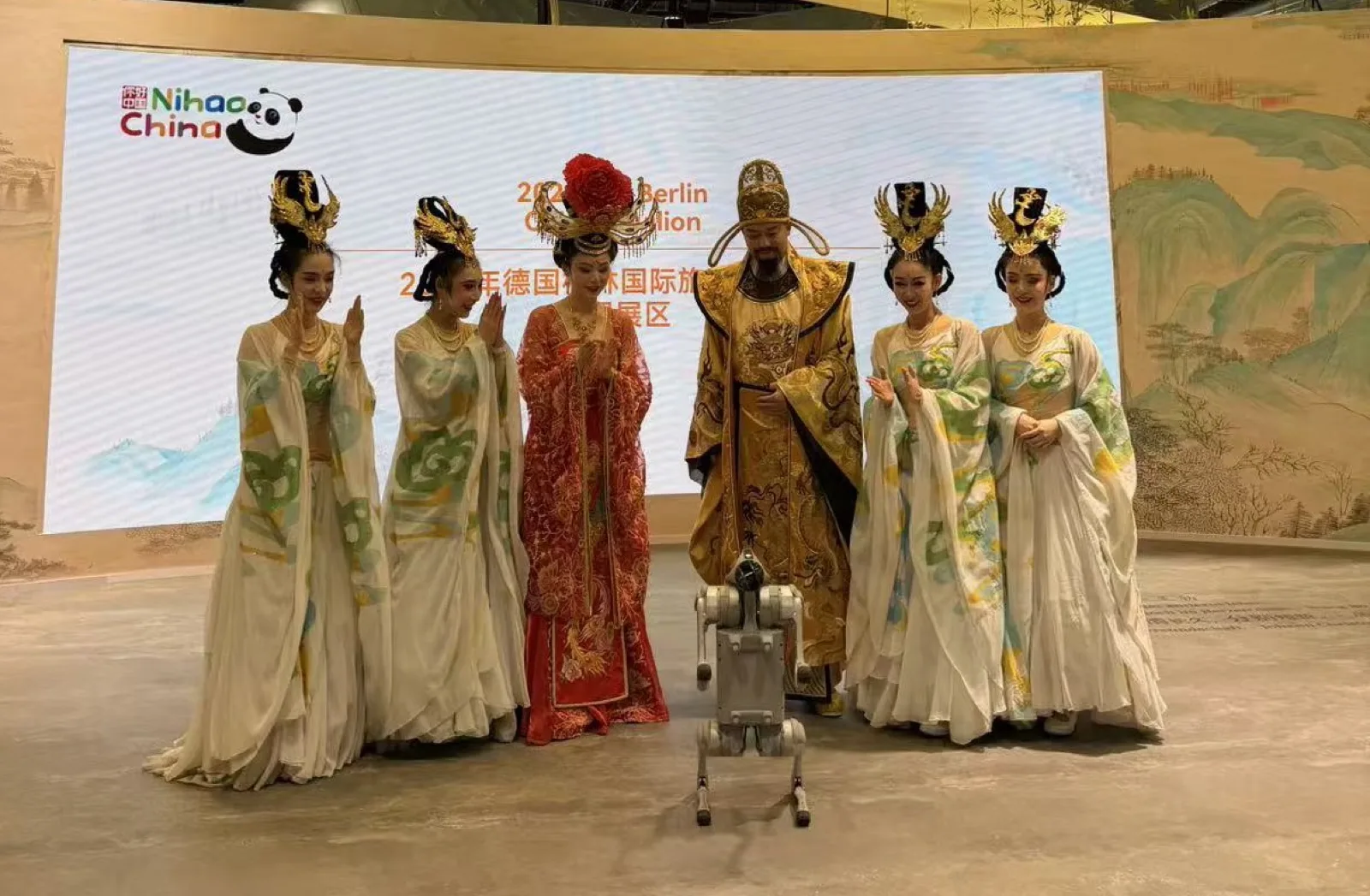 Visitors gathered around the robot dog demonstration